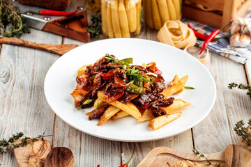 Wall Mural - Gourmet cafe dish stewed beef with potato fries