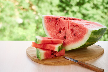 Wall Mural - Pieces of chopped watermelon on a wooden board,