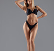 © serhiibobyk - Woman on heels posing in lingerie.