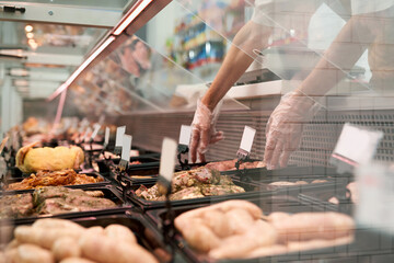 Raw meat in glass counter.