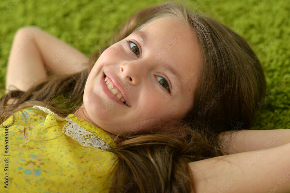 Portrait of beautiful teen girl lying on floor in room Stock Photo ...
