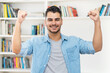 © Daniel Ernst - Cheering hispanic hipster man with beard and casual clothes