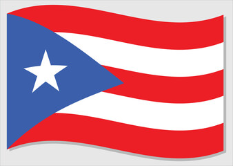 Waving flag of Puerto Rico vector graphic. Waving Puerto Rican flag illustration. Puerto Rico country flag wavin in the wind is a symbol of freedom and independence.