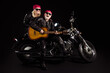 © deagreez - Photo of aged bikers man lady couple sit chopper moto feel young rock bike festival meeting play sing guitar band wear trendy rocker leather jacket pants isolated black color background