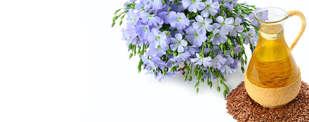 Wall Mural - Linseed oil, flax seeds, and flowers isolated on a white . Wide photo. Free space for text.