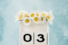 Number Three With Wooden Cubes Decorated With Daisy Flowers