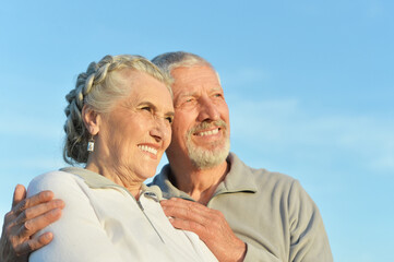 Wall Mural - Close-up portrait of happy senior couple hugging