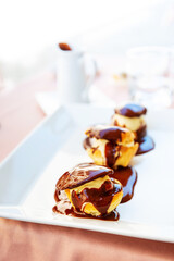 Wall Mural - French Profiteroles with chocolate sauce