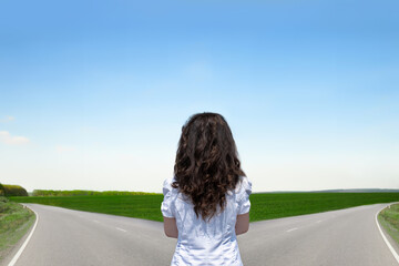 A business woman thinking which way to choose.The concept of the solution: the path to success and the path of risk.Copy space for text.