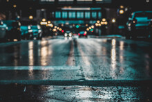 Illuminated City Street During Rainy Season At Night