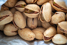 Close Up Of Roasted Salted Pistachios Nuts Inside An Open Paper Bag