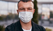Guy in medical mask on street
