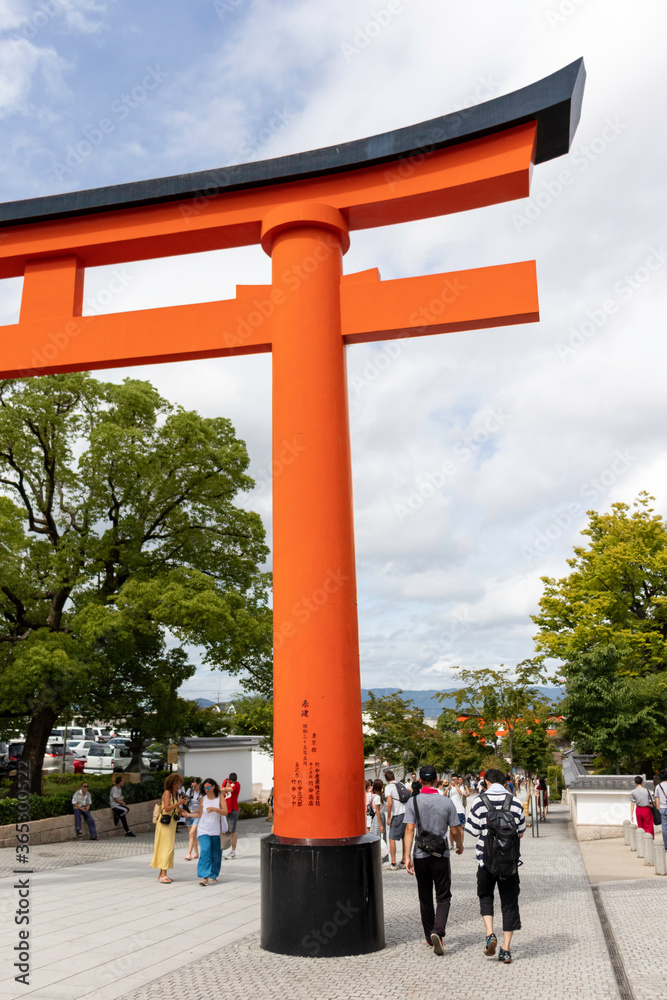 A giant torii gate in front of Romon Gate at the shrine's entrance of ...