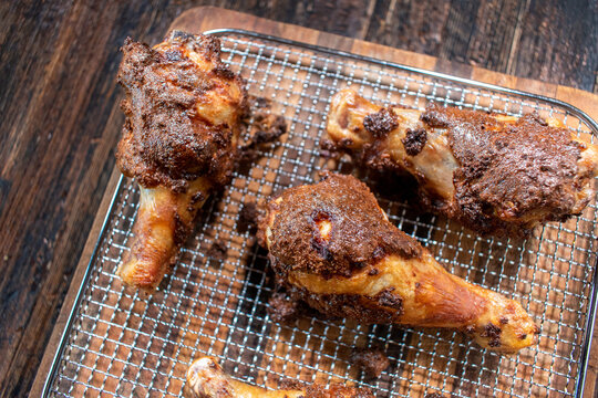 air fried chicken legs with crunchy coating on wire rack