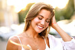 ©  AnnaHar - Sensual young woman with amazing smile posing on the street at sunset light, casual stylish out and golden accessories, natural pure beauty.