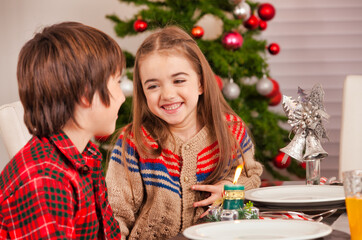 Sticker - Christmas scene at home. Happy bother and sister smiling