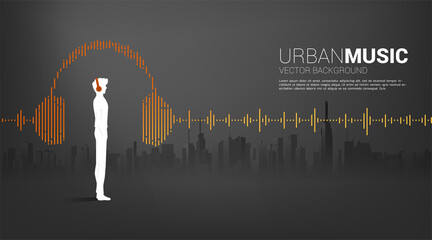 Poster - Silhouette of man with headphone and Sound wave Music Equalizer background with city background. audio visual headphone icon with line wave graphic style