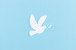 © Phongsakorn - White dove made from paper cut for Peace day background. International peace day concept . Copy space.