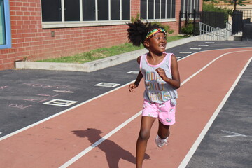 Wall Mural - Cute black girl running around full body shot on summer day