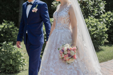 groom with bride together in summer park