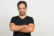 © Ranta Images - Portrait of handsome bearded Hispanic man with curly hair