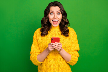 Sticker - Astonished cheerful girl addicted blogger use smartphone impressed by new followers comments scream wow omg wear style stylish trendy sweater isolated bright shine color background