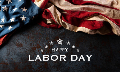 Wall Mural - Happy labor day text with America flag over black stone texture background.