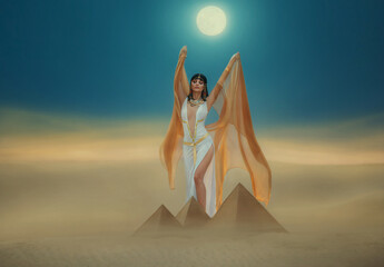 Wall Mural - Artwork Fantasy egyptian beauty goddess Cleopatra raises hands to blue night sky, backdrop pyramid yellow sand dune bright moon light. Orange golden cape white sexy dress. Black hair queen Nefertiti