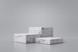 Three step of white marble product display on gray background with modern backdrops studio. Empty pedestal or podium platform. 3D Rendering.