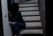 Sad young woman sitting in the house, People with depression concept. 
