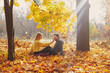 © Myshkovskyi - Happy young couple outdoors on a beautiful autumn day in the forest