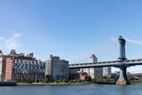 Fototapeta Nowy Jork - Riverfront of Dumbo Brooklyn with the Manhattan Bridge over the East River in New York City