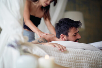 Wall Mural - lovers enjoying massage in their bedroom