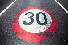 30km/h Speed Limit Sign Painted On Asphalting Road.