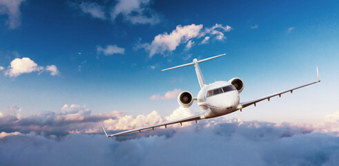 Private jetplane flying above clouds