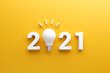 © oatawa - 2021 creativity inspiration concepts, Light bulb idea with 2021 new year on yellow background, planning ideas.