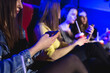 © Studio Peace - Distracted girl is watching on the phone. She is bored with watching movie.