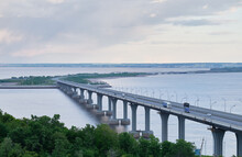 Bridge Over River. Magpie Mountains. Bridge Over The Kama River. Evening Summer Landscape. Big Bridge With Cars