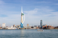 The Spinnaker Tower With A Speedboat In The Foreground And Gunwharf Quays With The Spinnaker Tower In The Background