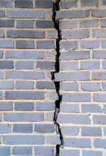 Cracked Gray Brick Wall Texture. Grunge Background.