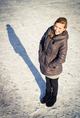 Wall Mural - Beautiful young blonde girl in winter.