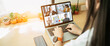 © Yingyaipumi - Businesswoman and Business team in video conference for protection covid-19.woman watching laptop webinar video course at home office.Webinar,social distancing,e learning and seminar online Concept.