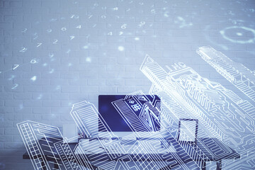 Desktop computer background in office and big town buildings hologram drawing. Double exposure. Smart city concept.