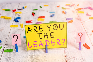 Poster - Text sign showing Are You The Leader Question. Business photo text asking for the qualification of being a good boss Scribbled and crumbling sheet with paper clips placed on the wooden table