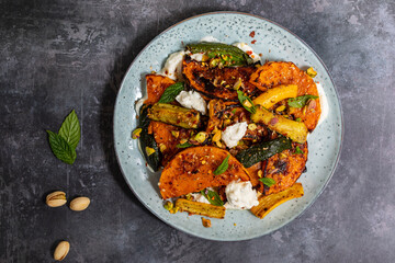 Wall Mural - Roast butternut squash and courgettes with feta and yougurt sauce