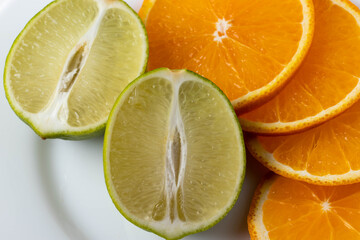 sliced citruses on white 