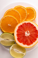 Wall Mural - sliced citruses on white 