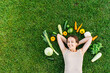 © Vadim Pastuh - Healthy food and healthy mind. Happy young woman lays surrounded fresh vegetables on green grass and dreams with eyes closed. Healthy lifestyle concept