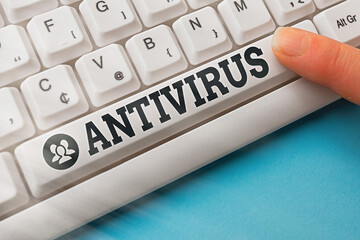 Wall Mural - Word writing text Antivirus. Business photo showcasing suitable for the detection and removal of computer viruses Pc keyboard key with pointing finger above background copy space