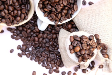 Poster - Top view coffee cup and coffee beans on wood table, space for text